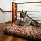 pendleton dog bed with water-resistant fabric featuring southwestern print and a dog lying on it indoors